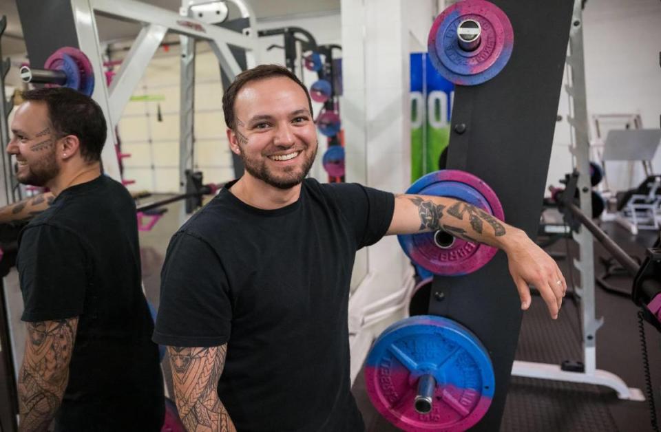 Hayden Glenn, co-founder and primary trainer at Queers and Allies Fitness, stands in his gym July 7 in East Sacramento. “Long story short, I had experienced some discrimination in the gym after I’d been outed,” he said about working in a gym in far Northern California, “and that’s sort of the beginning of this.” He added, “I realized this would have been an awesome resource for me to have, and I decided I want to be part of that journey for other people.”