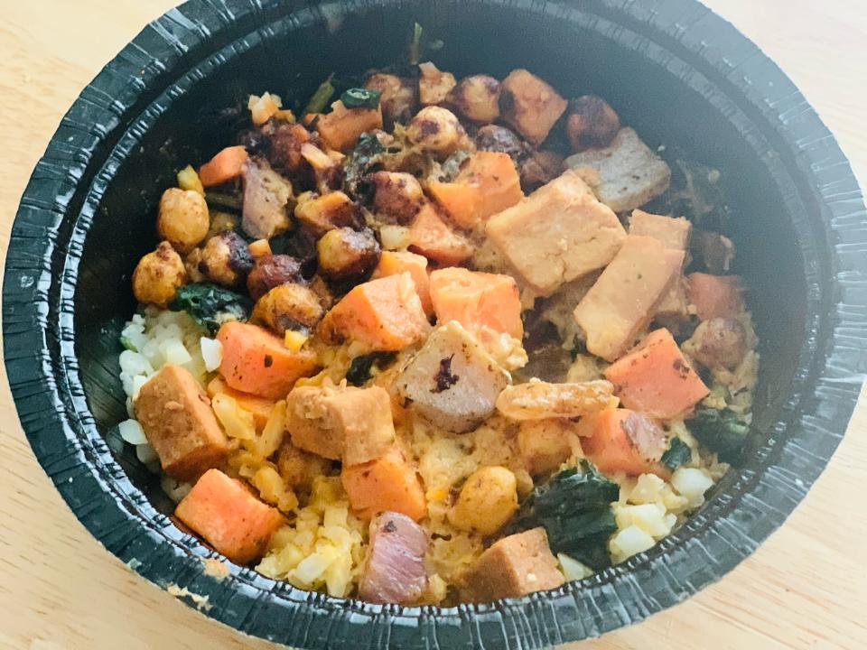 Interior of Trader Joe's riced cauliflower bowl, with tofu, chickpeas, and veggies