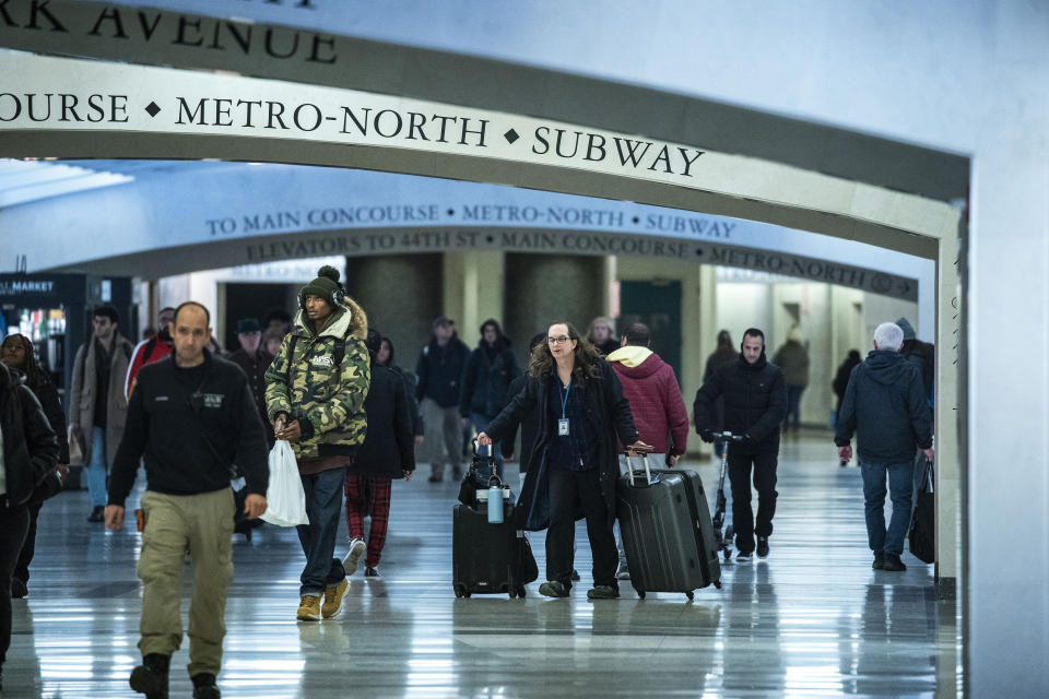 Travelers look for their gates at Grand Central Station in New York, Thursday, Dec. 21, 2023. (AP Photo/Eduardo Munoz Alvarez)