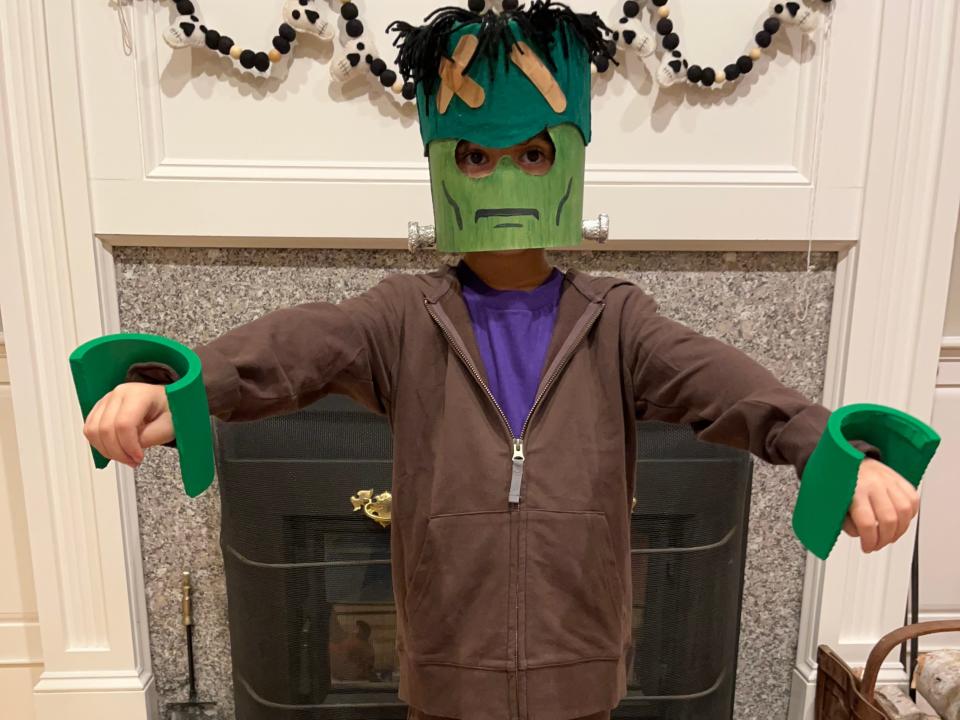 Kid dressed as Lego Frankenstein