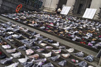 The annual women's shoe memorial is pictured on the steps of the Art Gallery in Vancouver, British Columbia December 6, 2012. The memorial, consisting of several hundred pairs of shoes in memory of all missing and murdered women in Canada, is displayed annually on the anniversary of the Montreal Ecole Polytechnique massacre that took place in 1989. REUTERS/Andy Clark (CANADA - Tags: SOCIETY CRIME LAW ANNIVERSARY TPX IMAGES OF THE DAY)