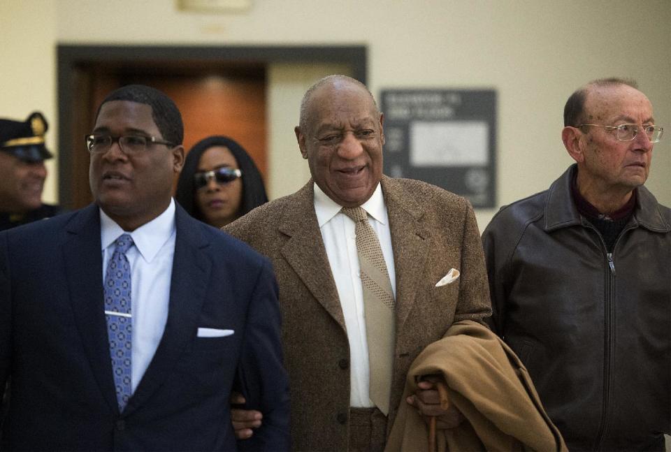 Bill Cosby, center, arrives for a pretrial hearing in his sexual assault case at the Montgomery County Courthouse in Norristown, Pa., Wednesday, Dec. 14, 2016. He is charged with sexually assaulting one woman in 2004, but prosecutors are hoping to call 13 other accusers to testify at his spring trial. (Chloe Elmer/Bucks County Courier Times via AP, Pool)