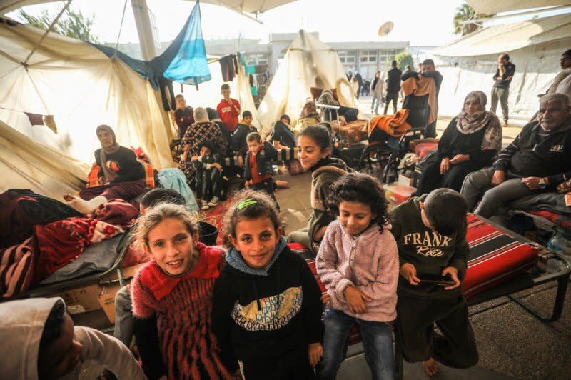 Thousands of Palestinians displaced by Israeli attacks take refuge at the European Hospital in Khan Younis, Gaza on Sunday. Israeli Defense Minister Yoav Gallant said Tuesday fighting remained intense even after Israel withdrew some troops and that any "sense that we are stopping is wrong." Photo by Ismael Mohamad/UPI