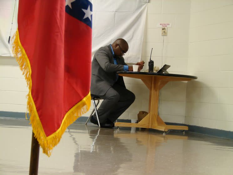 Solomon Graves, a spokesman for the Arkansas Department of Correction, waits for a telephone call with news of the death of Ledell Lee. (AP Photo/Kelly P. Kissel)