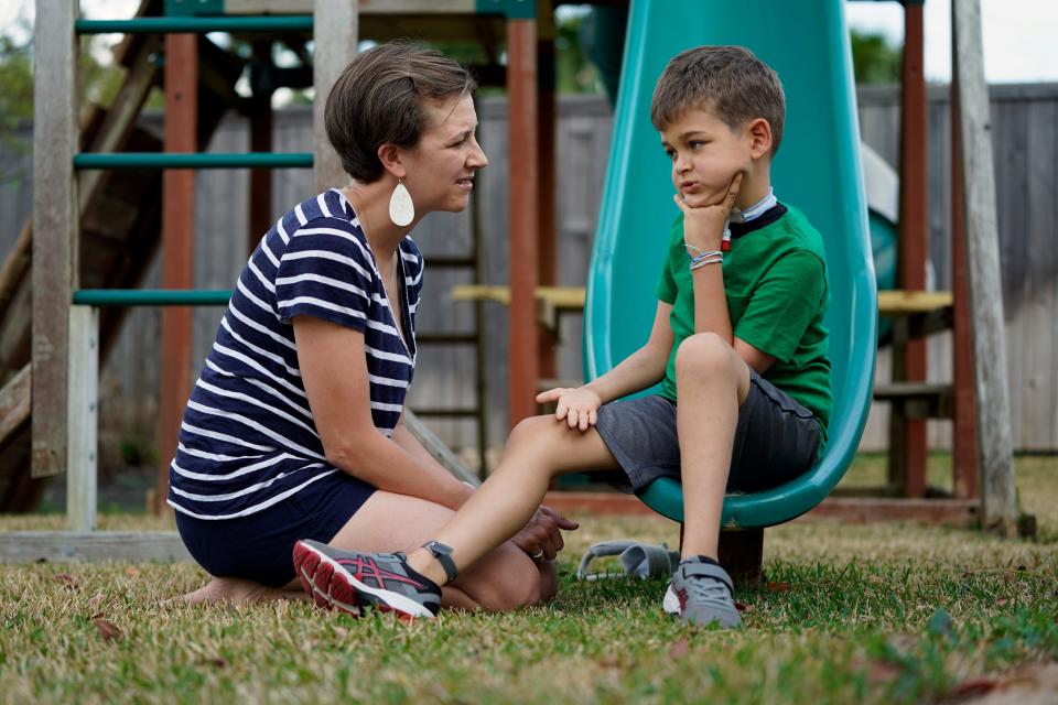 Rachel Scott, left, talks with her son, Braden, in Tomball, Texas, on Friday, March 29, 2019. “Everyone is desperate for some magical thing” to cure the kids, said Rachel. Braden developed acute flaccid myelitis, or AFM, in 2016.