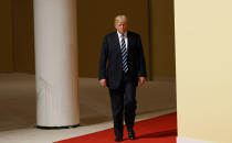 <p>President Donald Trump walks to meet with German Chancellor Angela Merkel after arriving at the G20 Summit, Friday, July 7, 2017, in Hamburg, Germany. Merkel is welcoming leaders of the Group of 20 global economic powers to a two-day summit in Hamburg. The meeting at the city’s trade fair center opens Friday with a discussion on fighting terrorism — one of the least contentious subjects on an agenda that also includes global trade and climate. (Photo: Evan Vucci/AP) </p>