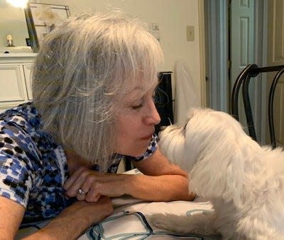 Jo Anna Dressler Kloster, of New Bern, wrote a novel, "Lily Unleashed," which explores the conditions dogs face in puppy mills based on her own dog, Cagney, who was rescued from a puppy mill after being locked in cage for seven months of his life.