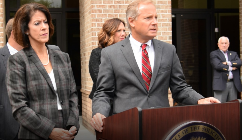 Kimberly Smith (center, back row), then Assistant Solicitor, stands behind 14th Circuit Solicitor Duffie Stone at a news conference in 2019.