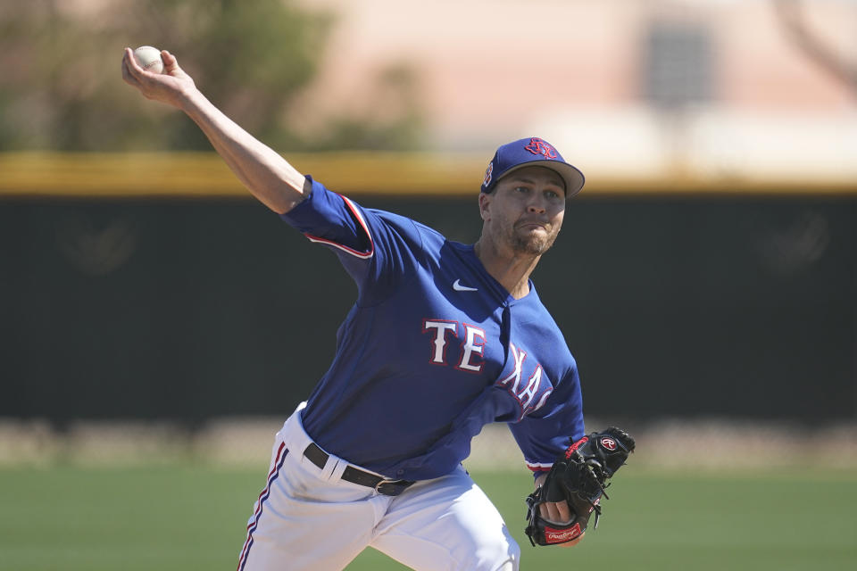 Texas Rangers starting pitcher Jacob deGrom delivers during the first inning of a AA baseball rehabilitation start for the Frisco RoughRiders against the Northwest Arkansas Naturals, Monday, March 13, 2023, in Surprise, Ariz. (AP Photo/Abbie Parr)