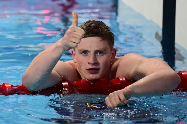 Britain's Adam Peaty celebrates after winning semi-final 2 of the men's 100m breastroke swimming event at the 2015 FINA World Championships in Kazan on August 2, 2015