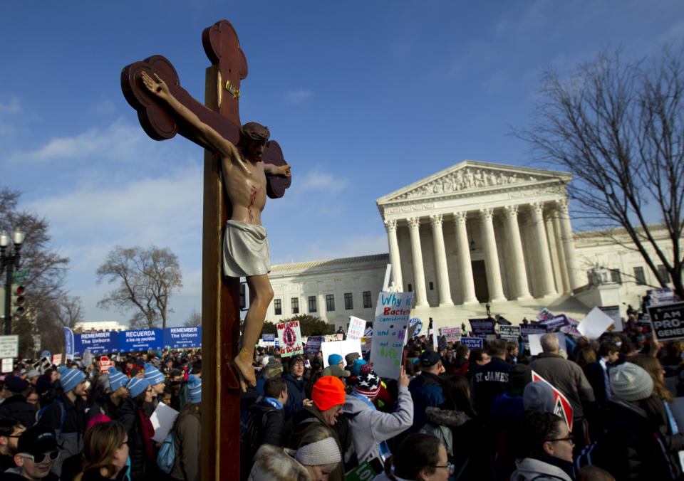 FILE - In this Friday, Jan. 18, 2019 file photo, anti-abortion activists march outside the U.S. Supreme Court building, during the March for Life in Washington. The anti-abortion movement's clout in many state legislatures has now been amplified by Donald Trump's election as president after he promised to support the movement's key goals. (AP Photo/Jose Luis Magana)