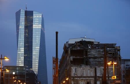 The new European Central Bank (ECB) headquarters are pictured behind partially dismantled Sudfass brothel club in Frankfurt, November 22, 2014. REUTERS/Kai Pfaffenbach