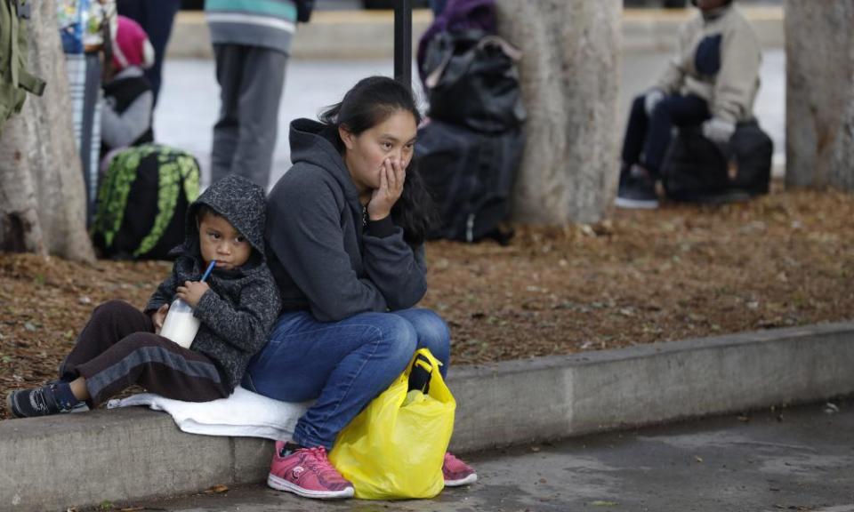 Migrants wait for a chance to request US asylum, alongside the border crossing in Tijuana, Mexico.