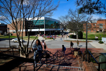 Students walk between classes at North Carolina A&T University just to the west of the line that divides Congressional Districts 13 and 6 on campus in Greensboro, North Carolina, U.S. March 14, 2019. Picture taken March 14, 2019. REUTERS/Charles Mostoller