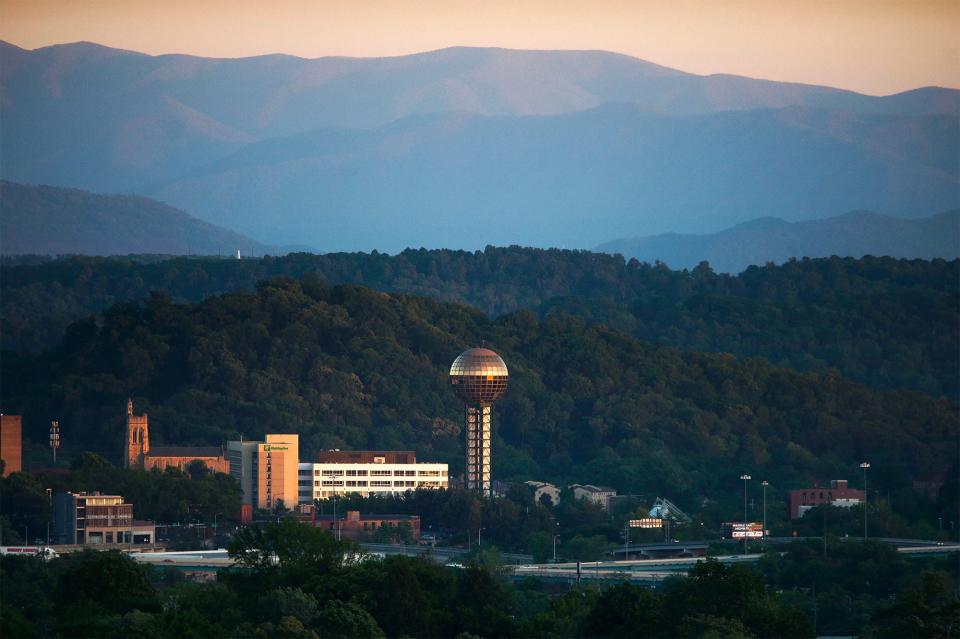 The Sunsphere stands in front of the Smoky Mountains on a clear day as seen from Sharps Ridge Memorial Park in North Knoxville on Monday, May 1, 2017.