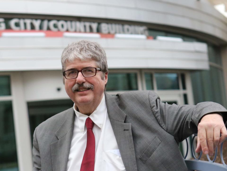 John Flaherty, a board member for the Delaware Coalition for Open Government, in front of the Louis L. Redding City/County Building in 2017.