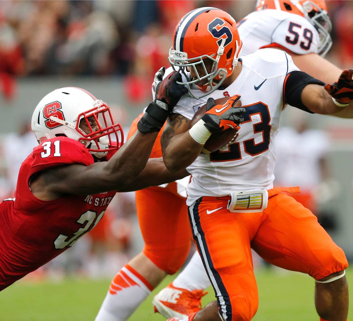 N.C. State linebacker D.J. Green (31) is called for a face mask penalty on Syracuse running back Prince-Tyson Gulley (23) during the first half of N.C. State’s game against Syracuse Saturday, October 12, 2013, at Carter-Finley Stadium in Raleigh, N.C.