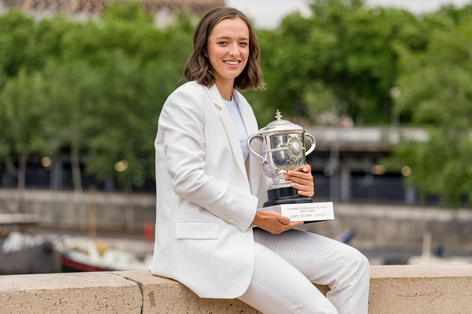 Iga Swiatek, pictured here showing off the French Open trophy in Paris.