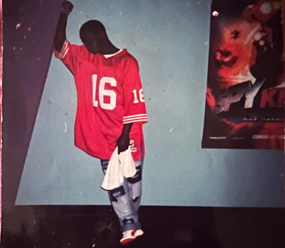 Emmanuel Jean, 15, poses for a photo in 2002 outside the movie theater at Aventura Mall. Jean was released from prison 16 years after being wrongfully accused.