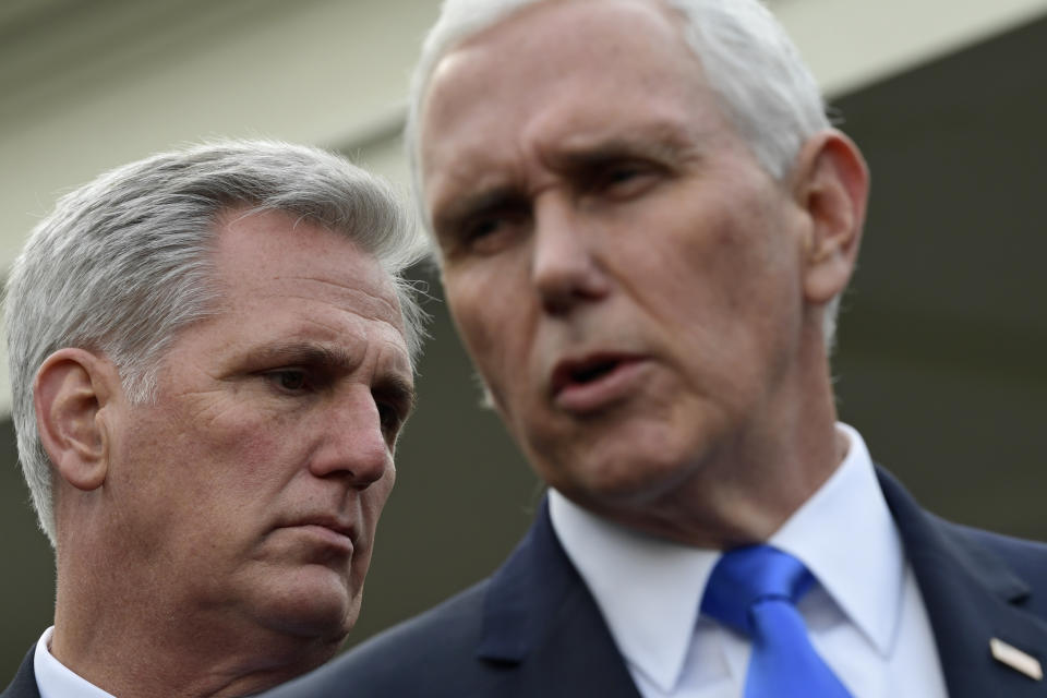 Vice President Mike Pence, right, standing with House Minority Leader Kevin McCarthy of Calif., left, speaks to reporters following a meeting with President Donald Trump and Democratic congressional leaders at the White House in Washington, Wednesday, Jan. 9, 2019. (AP Photo/Susan Walsh)