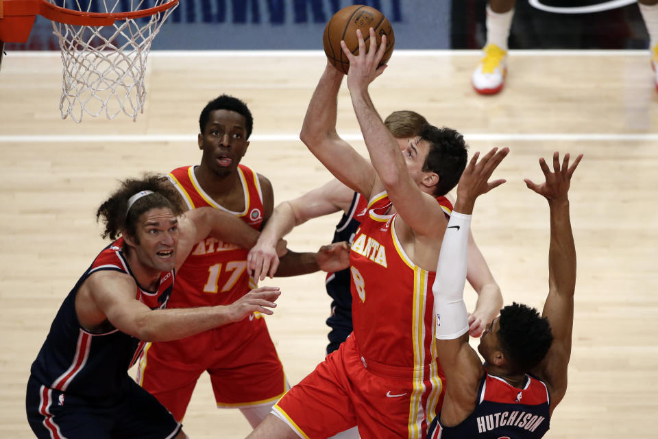 Atlanta Hawks forward Danilo Gallinari (8) takes it to the basket during the first half of an NBA basketball game against the Washington Wizards Wednesday, May 12, 2021, in Atlanta. (AP Photo/Butch Dill)