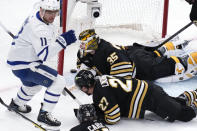 Boston Bruins goaltender Linus Ullmark (35) lies on the crease after giving up a goal to Toronto Maple Leafs center Max Domi (11) during the first period of Game 2 of an NHL hockey Stanley Cup first-round playoff series, Monday, April 22, 2024, in Boston. (AP Photo/Charles Krupa)