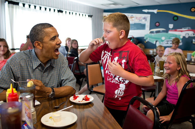 <b>July 5, 2012:</b> "'Anyone want to try a piece of my strawberry pie,' the President asked those at adjacent tables during a stop for lunch at Kozy Corners restaurant in Oak Harbor, Ohio. A young boy said yes and came over for a big bite of pie." (Official White House Photo by Pete Souza)