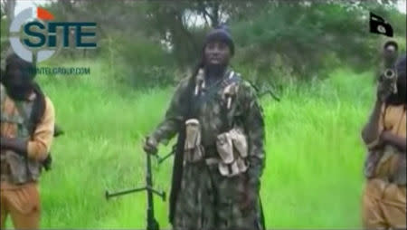 A man purporting to be Boko Haram's leader Abubakar Shekau (C) speaks in this still frame taken from social media video courtesy of SITE Intel Group, released on August 10, 2016, in an unknown location. MANDATORY CREDIT Social Media courtesy of SITE INTEL GROUP/ via REUTERS TV