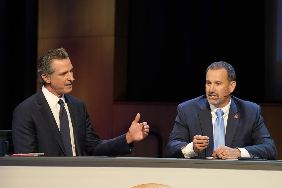 Gubernatorial candidates, Democratic Gov. Gavin Newsom, left, and Republican challenger state Sen. Brian Dahle spar during their debate held by KQED Public Television in San Francisco, on Sunday, Oct. 23, 2022. (AP Photo/Rich Pedroncelli, Pool)