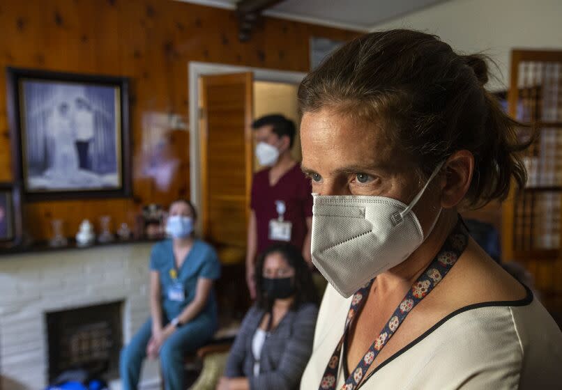 LOS ANGELES, CA-OCTOBER 7, 2022: Janina Lord Morrison, Chief Physician for the Los Angeles County Department of Public Health, is photographed at the home of Louis Salazar Sr. 90, his son Louis Jr., 64, and wife Maria Salazar, 88, who all received a dose of the Moderna COVID-19 booster vaccine. The Los Angeles County Department of Public Health runs a program that provide COVID vaccines to people who are homebound. (Mel Melcon / Los Angeles Times)