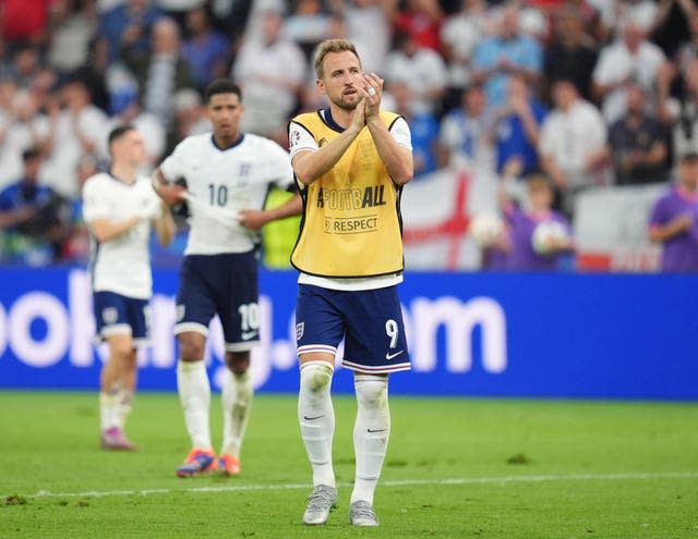 A disappointed-looking Harry Kane applauds the fans after the draw with Denmark