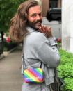 <em>Queer Eye</em>'s JVN wore a special edition Balenciaga Ville XS rainbow-striped mini bag during the Chicago stop on his <em>Road to Beijing</em> comedy world tour.