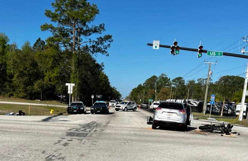 Officials reroute traffic at the scene of a fatal wreck on Monday morning at State Road 206 and U.S. 1 in St. Johns County.