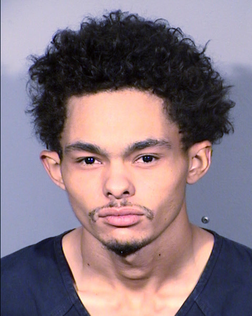 This undated photo provided by Las Vegas police shows Tyson Hampton, 24, of Las Vegas. Police say Hampton was arrested early Thursday, Oct. 13, 2022, as the suspect in a shooting that killed veteran Police Officer Truong Thai. (Las Vegas Metropolitan Police Department via AP)