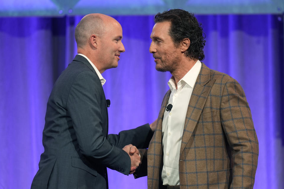 Utah Gov. Spencer Cox, left, greets actor Matthew McConaughey at the 2024 summer meeting of the National Governors Association Friday, July 12, 2024, in Salt Lake City. (AP Photo/Rick Bowmer)