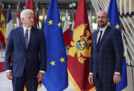 Montenegro's Prime Minister Dusko Markovic, left, and European Council President Charles Michel pose for the media before their meeting at the Europa building in Brussels, Monday, July 13, 2020. (Stephanie Lecocq, Pool Photo via AP)