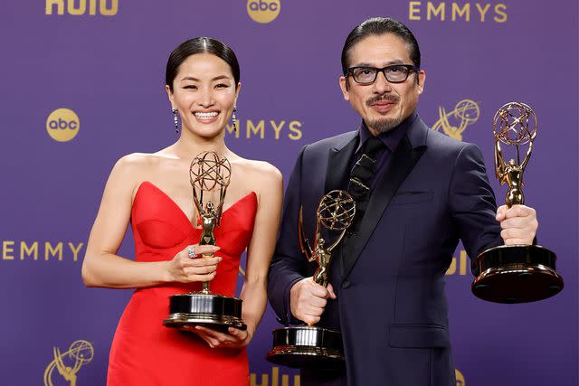 <p>Frazer Harrison/Getty</p> Anna Sawai and Hiroyuki Sanada pose with their trophies at the 2024 Emmys