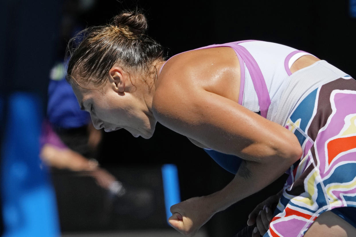 Aryna Sabalenka of Belarus reacts after defeating Donna Vekic of Croatia in their quarterfinal match at the Australian Open tennis championship in Melbourne, Australia, Wednesday, Jan. 25, 2023. (AP Photo/Aaron Favila)