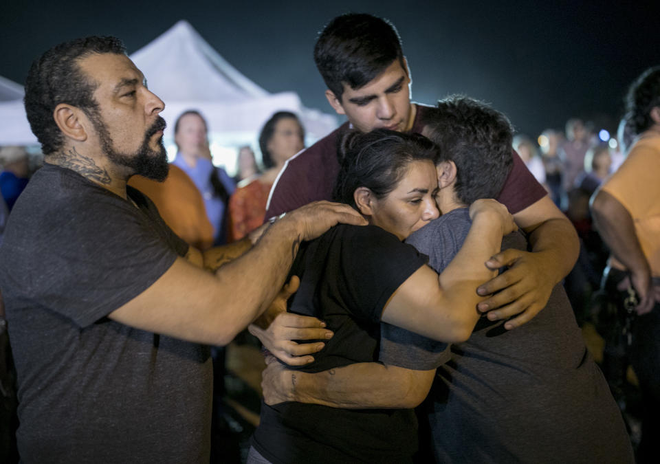 <p>Jennifer Palacios, center, the biological mother of 14-year-old Annabelle Pomeroy who died in a mass shooting in Sutherland Springs, Texas, is comforted by, from left to right, her boyfriend Fritz Rymers, her son Timothy Rodriguez and her mother Diana Palacios, at a memorial service in Sutherland Springs, Monday, Nov. 6, 2017. (Photo: Jay Janner/Austin American-Statesman via AP) </p>