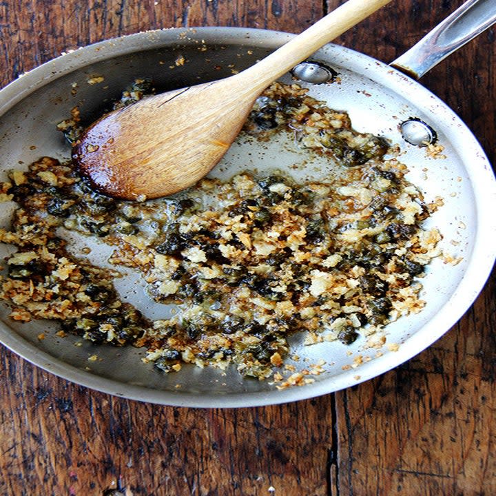 Fried capers and butter in a sauce pan.