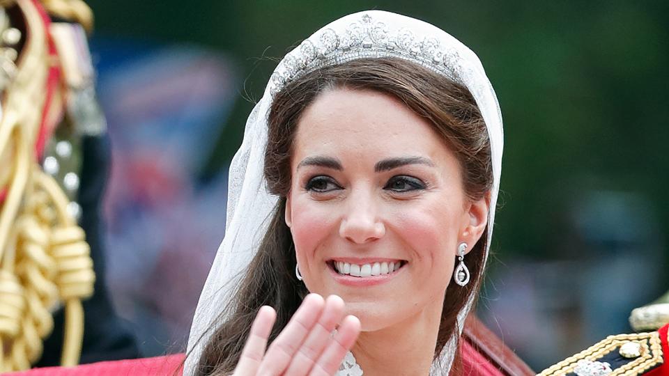 Kate in wedding dress in carriage