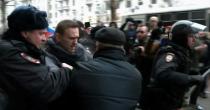 Alexei Navalny has been banned from running for president and was detained at a rally urging voters to boycott the vote