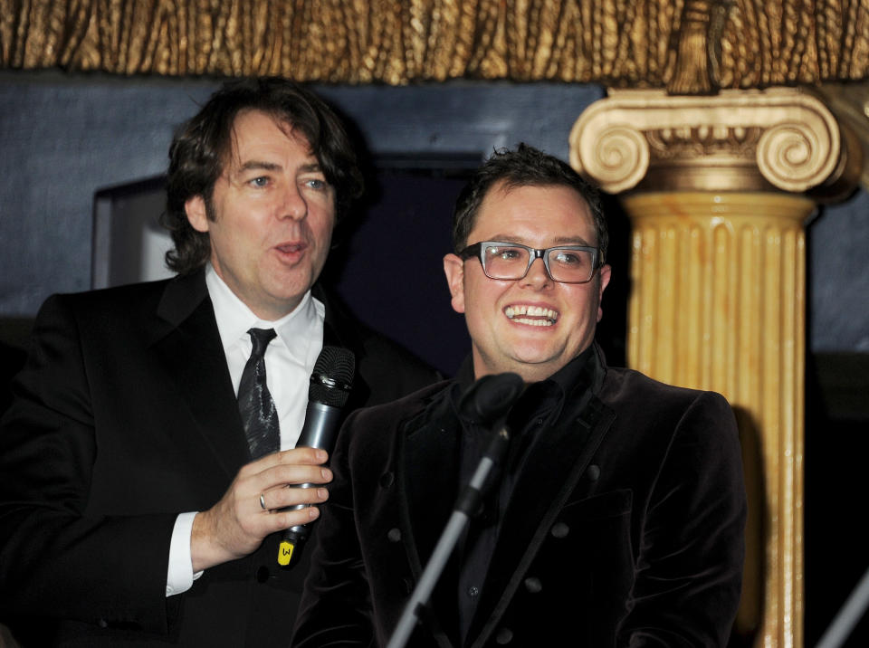 LONDON, ENGLAND - NOVEMBER 21:  (NO UK MAGAZINE USE. NO ONLINE UK MAGAZINE USE. NO VOGUE OR VOGUE ONLINE USE. EMBARGOED FOR PUBLICATION IN UK TABLOID NEWSPAPERS UNTIL 48 HOURS AFTER CREATE DATE AND TIME. MANDATORY CREDIT PHOTO BY DAVE M. BENETT/GETTY IMAGES REQUIRED)  Jonathan Ross (L) and Alan Carr host The Hoping Variety Show: A Benefit Evening For Palestinian Refugee Children at Cafe de Paris on November 21, 2011 in London, England.  (Photo by Dave M. Benett/Getty Images)