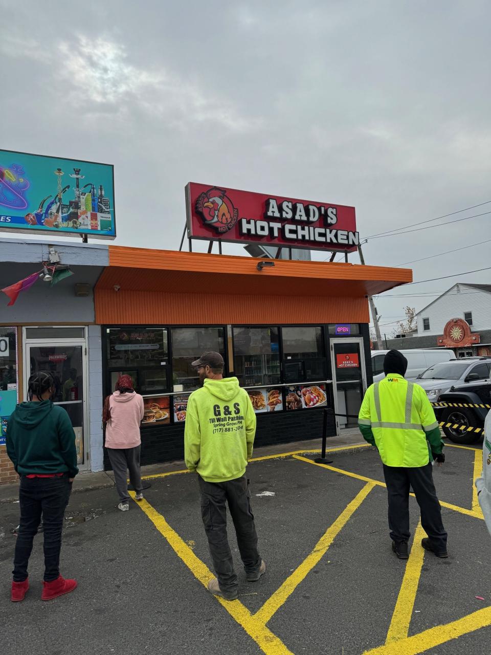A line forms at 11 a.m. on Nov. 7 at Asad's Hot Chicken in Burlington City. The restaurant opened recently.