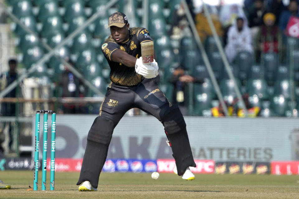 Peshawar Zalmi' Rovman Powell plays a shot during the Pakistan Super League T20 cricket match between Peshawar Zalmi and Karachi Kinds, in Lahore, Pakistan Wednesday, Feb. 21, 2024. (AP Photo/K.M. Chaudary)