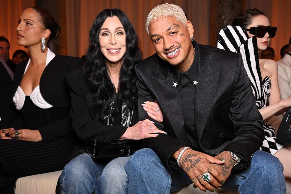 <p>Stephane Cardinale - Corbis/Corbis via Getty</p> Cher and Alexander "AE" Edwards at Balmain during Paris Fashion Week