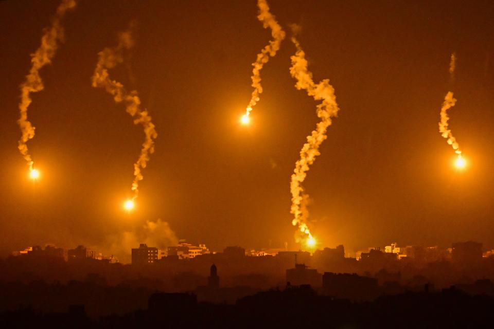 This picture taken from a position near Sderot along the Israeli border with the Gaza Strip on November 5, 2023, shows flares dropped by Israeli forces above the Palestinian enclave amid ongoing battles between Israel and Hamas.