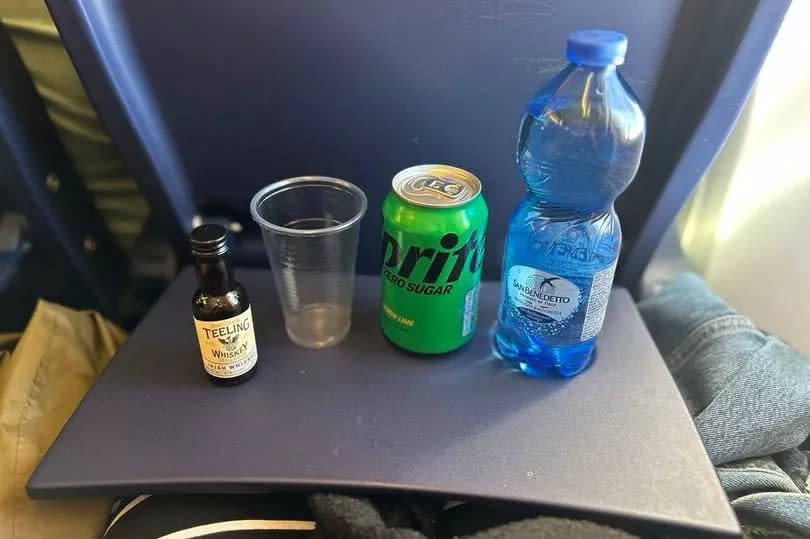 Photo shows drinks laid out on tray table