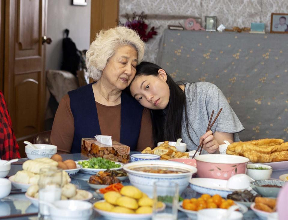This image released by A24 films shows Zhao Shuzhen, left, and Awkwafina in a scene from "The Farewell." On Monday, Dec. 9, 2019, Awkwafina was nominated for a Golden Globe for best actress in a motion picture comedy for her role in the film. (Casi Moss/A24 via AP)