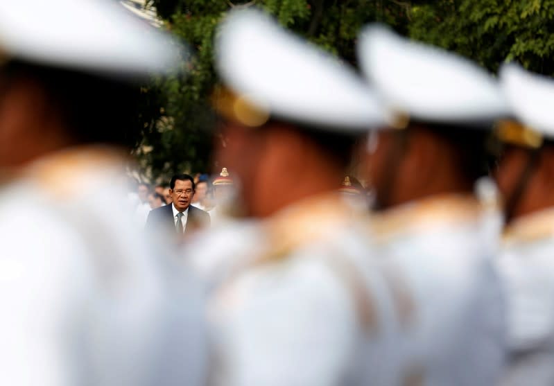 FILE PHOTO: Cambodia's Prime Minister Hun Sen attends a celebrations marking the 66th anniversary of the country's independence from France, in central Phnom Penh